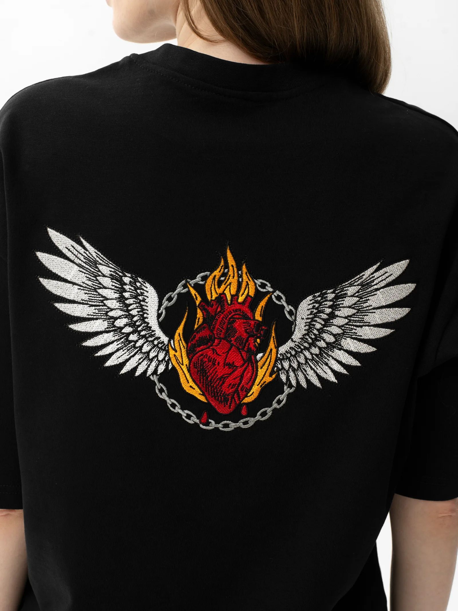 Burning Heart embroidery across the back of a Skull & Roses T-shirt