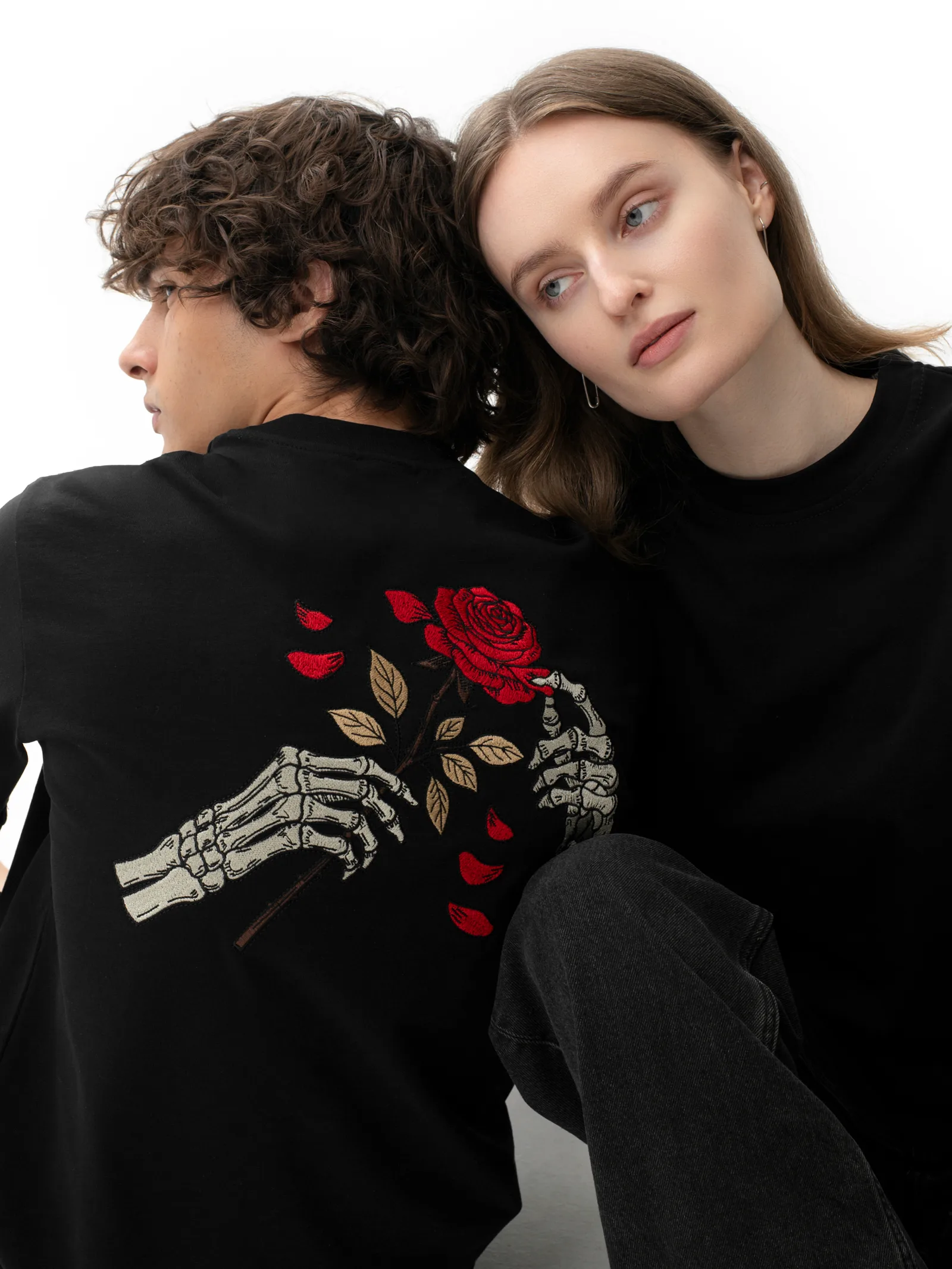Two models wearing the Skull & Roses Rose and Bones graphic T-shirt