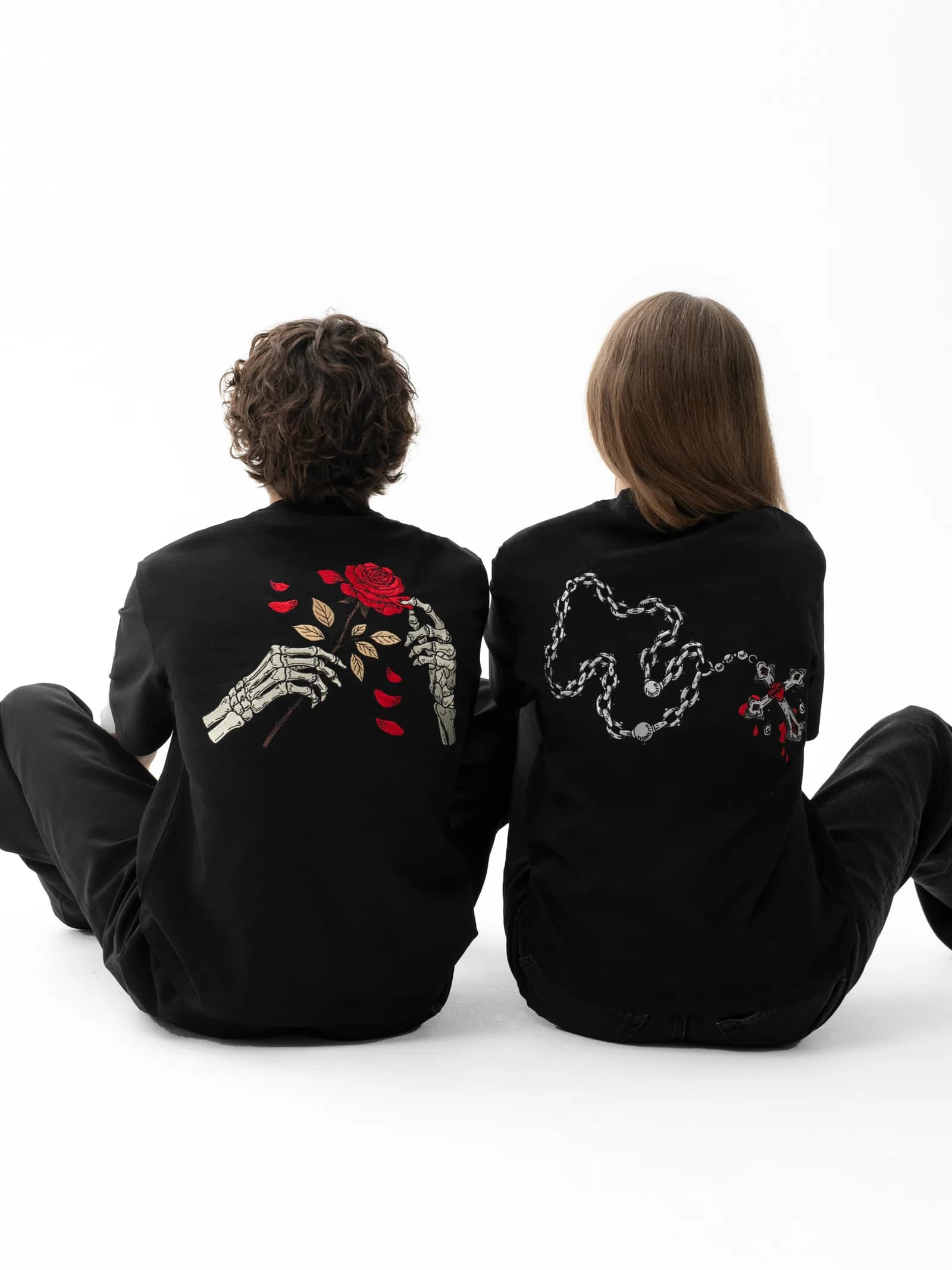 Two models showing the Rose and Cross Skull & Roses T-shirt graphics